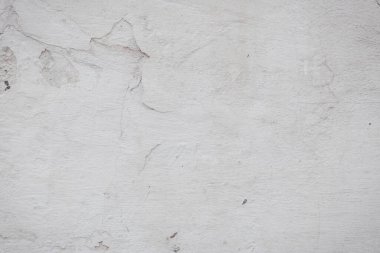 Çatlakları ve çizikleri olan eski beton duvarın dokusu arka plan olarak kullanılabilir.