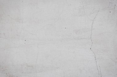 Çatlakları ve çizikleri olan eski beton duvarın dokusu arka plan olarak kullanılabilir.