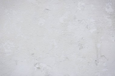 Çatlakları ve çizikleri olan eski beton duvarın dokusu arka plan olarak kullanılabilir.