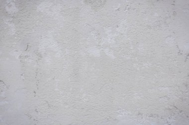 Çatlakları ve çizikleri olan eski beton duvarın dokusu arka plan olarak kullanılabilir.