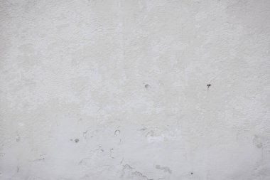 Çatlakları ve çizikleri olan eski beton duvarın dokusu arka plan olarak kullanılabilir.