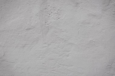 Çatlakları ve çizikleri olan eski beton duvarın dokusu arka plan olarak kullanılabilir.