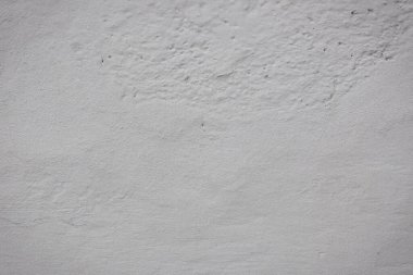 Çatlakları ve çizikleri olan beton bir duvarın dokusu arka plan olarak kullanılabilir.