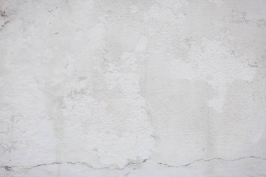 Çatlakları ve çizikleri olan eski beton duvarın dokusu arka plan olarak kullanılabilir.