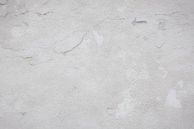 Çatlakları ve çizikleri olan eski beton duvarın dokusu arka plan olarak kullanılabilir.