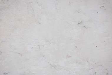 Çatlakları ve çizikleri olan eski beton duvarın dokusu arka plan olarak kullanılabilir.