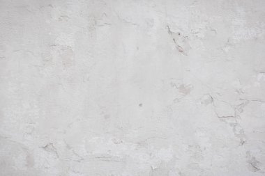 Çatlakları ve çizikleri olan eski beton duvarın dokusu arka plan olarak kullanılabilir.