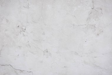 Çatlakları ve çizikleri olan eski beton duvarın dokusu arka plan olarak kullanılabilir.