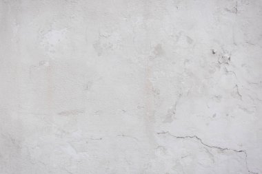 Çatlakları ve çizikleri olan eski beton duvarın dokusu arka plan olarak kullanılabilir.