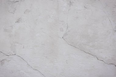 Çatlakları ve çizikleri olan beton bir duvarın dokusu arka plan olarak kullanılabilir.