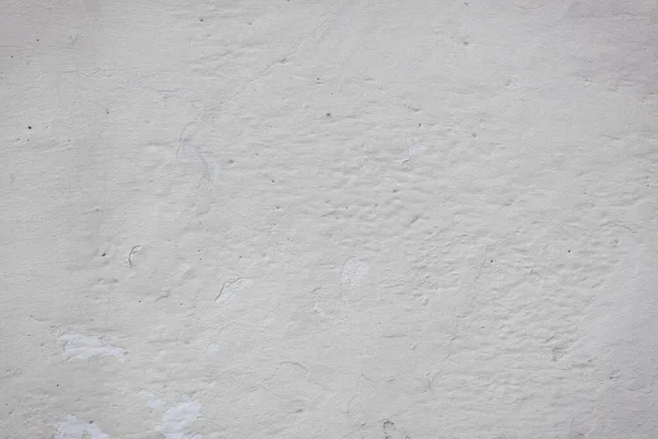 Çatlakları ve çizikleri olan eski beton duvarın dokusu arka plan olarak kullanılabilir.