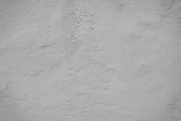 Çatlakları ve çizikleri olan eski beton duvarın dokusu arka plan olarak kullanılabilir.