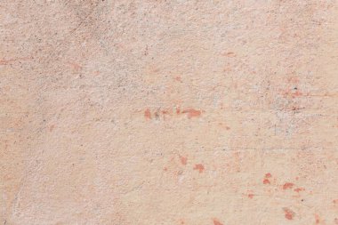 Çatlakları ve çizikleri olan beton bir duvarın dokusu arka plan olarak kullanılabilir.