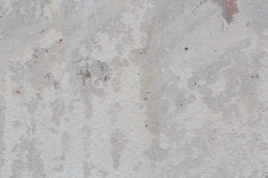 Çatlakları ve çizikleri olan eski beton duvarın dokusu arka plan olarak kullanılabilir.