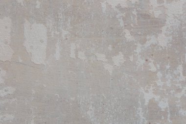 Çatlakları ve çizikleri olan eski beton duvarın dokusu arka plan olarak kullanılabilir.