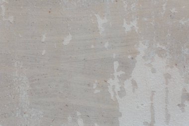 Çatlakları ve çizikleri olan eski beton duvarın dokusu arka plan olarak kullanılabilir.