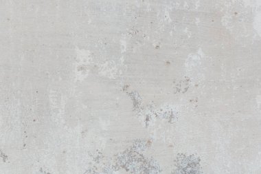 Çatlakları ve çizikleri olan eski beton duvarın dokusu arka plan olarak kullanılabilir.