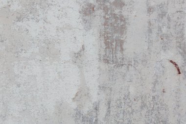 Çatlakları ve çizikleri olan eski beton duvarın dokusu arka plan olarak kullanılabilir.