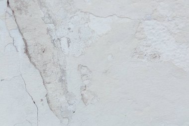 Çatlak beton duvarın çatlaklardan ve çiziklerden oluşan dokusu arka plan olarak kullanılabilir.