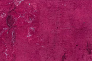 Çatlakları ve çizikleri olan eski beton duvarın dokusu arka plan olarak kullanılabilir.