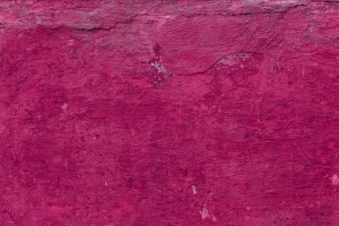 Çatlakları ve çizikleri olan eski beton duvarın dokusu arka plan olarak kullanılabilir.