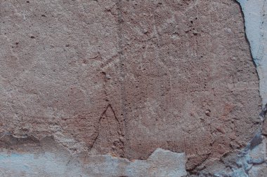 Çatlakları ve çizikleri olan beton bir duvarın dokusu arka plan olarak kullanılabilir.