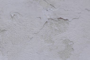 Çatlak beton duvarın çatlaklardan ve çiziklerden oluşan dokusu arka plan olarak kullanılabilir.