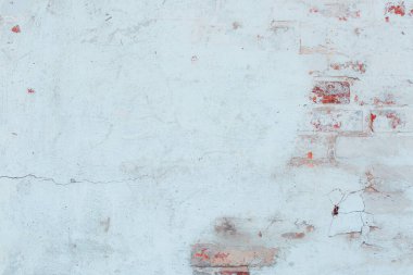 Çatlakları ve çizikleri olan beton bir duvarın dokusu arka plan olarak kullanılabilir.