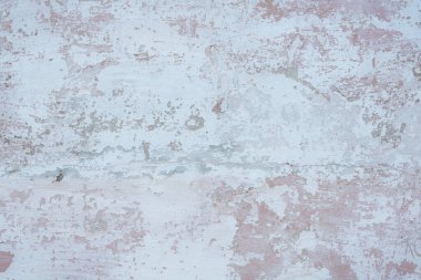 Çatlakları ve çizikleri olan eski beton duvarın dokusu arka plan olarak kullanılabilir.