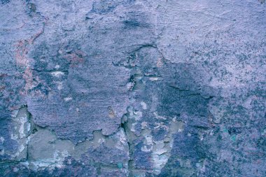 Çatlakları ve çizikleri olan beton bir duvarın dokusu arka plan olarak kullanılabilir.