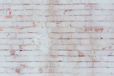 Çatlakları ve çizikleri olan tuğla duvar dokusu arka plan olarak kullanılabilir.