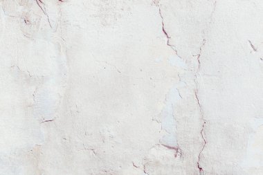 Çatlakları ve çizikleri olan beton bir duvarın dokusu arka plan olarak kullanılabilir.