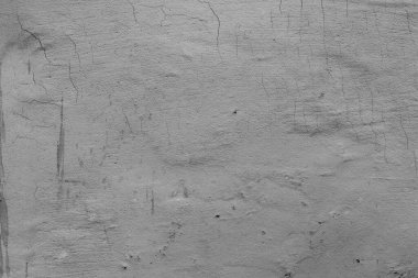 Çatlakları ve çizikleri olan beton bir duvarın dokusu arka plan olarak kullanılabilir.