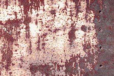 Çizik ve çatlaklarla eski paslı metal dokusu.