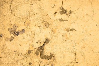 Eski taş duvarın dokusu. Kumun arkaplanı.