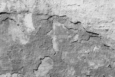 Çatlakları ve çizikleri olan beton bir duvarın dokusu arka plan olarak kullanılabilir.