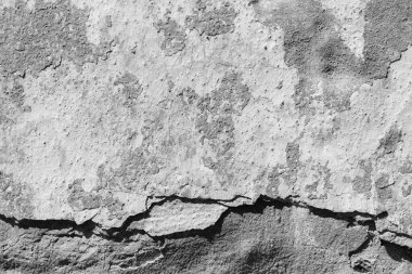 Çatlakları ve çizikleri olan beton bir duvarın dokusu arka plan olarak kullanılabilir.