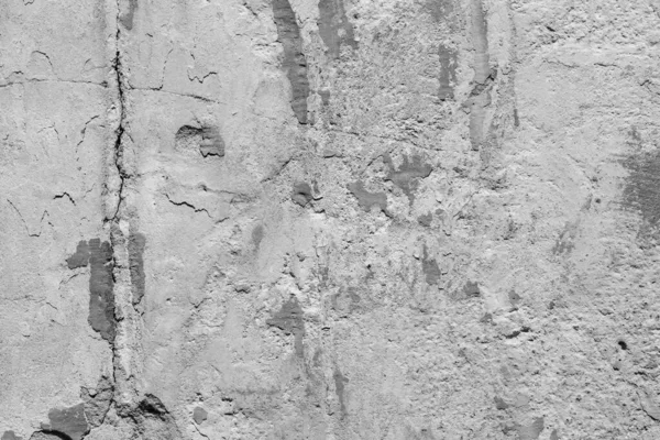 Çatlakları ve çizikleri olan eski beton duvarın dokusu arka plan olarak kullanılabilir.