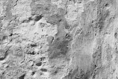 Çatlakları ve çizikleri olan beton bir duvarın dokusu arka plan olarak kullanılabilir.