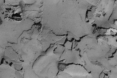 Çatlakları ve çizikleri olan beton bir duvarın dokusu arka plan olarak kullanılabilir.