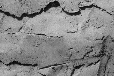 Çatlakları ve çizikleri olan beton bir duvarın dokusu arka plan olarak kullanılabilir.