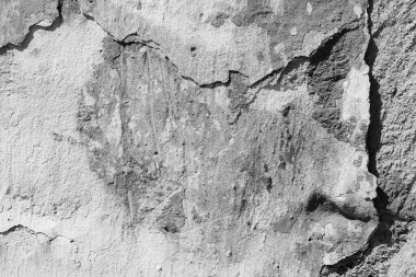 Çatlakları ve çizikleri olan beton bir duvarın dokusu arka plan olarak kullanılabilir.