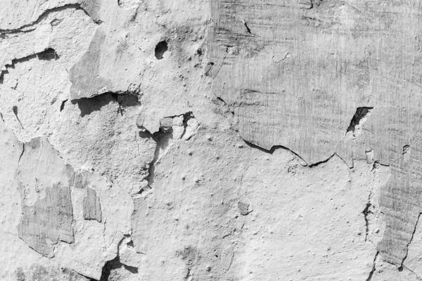 çatlakları ve çizikleri olan bir duvarın dokusu arka plan olarak kullanılabilir.