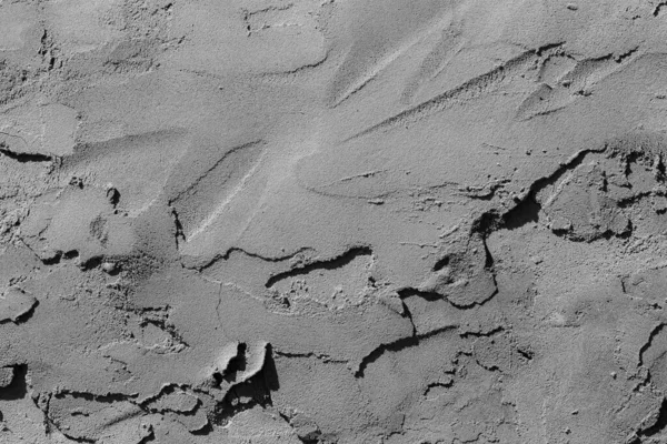 Çatlakları ve çizikleri olan beton bir duvarın dokusu arka plan olarak kullanılabilir.