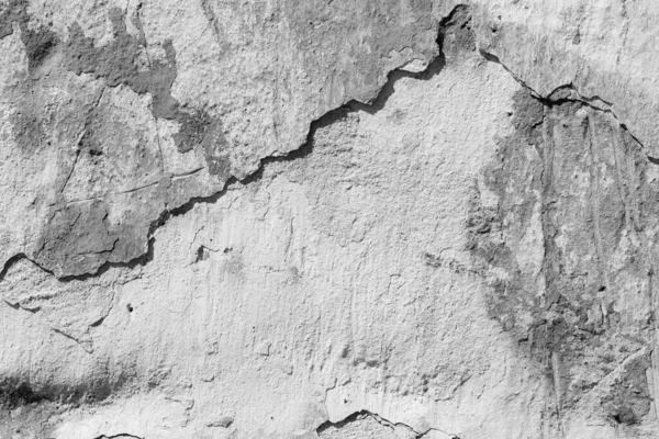 Çatlakları ve çizikleri olan beton bir duvarın dokusu arka plan olarak kullanılabilir.