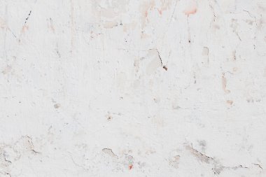 Çatlakları ve çizikleri olan eski beton duvarın dokusu arka plan olarak kullanılabilir.