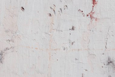 Çatlakları ve çizikleri olan beton bir duvarın dokusu arka plan olarak kullanılabilir.