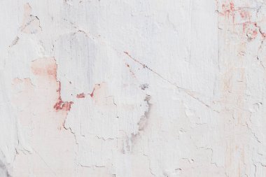 Çatlakları ve çizikleri olan eski beton duvarın dokusu arka plan olarak kullanılabilir.