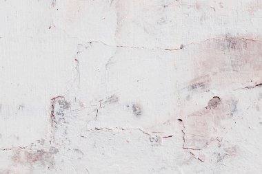 Çatlakları ve çizikleri olan eski beton duvarın dokusu arka plan olarak kullanılabilir.
