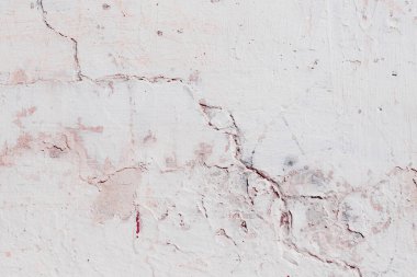 Çatlakları ve çizikleri olan beton bir duvarın dokusu arka plan olarak kullanılabilir.